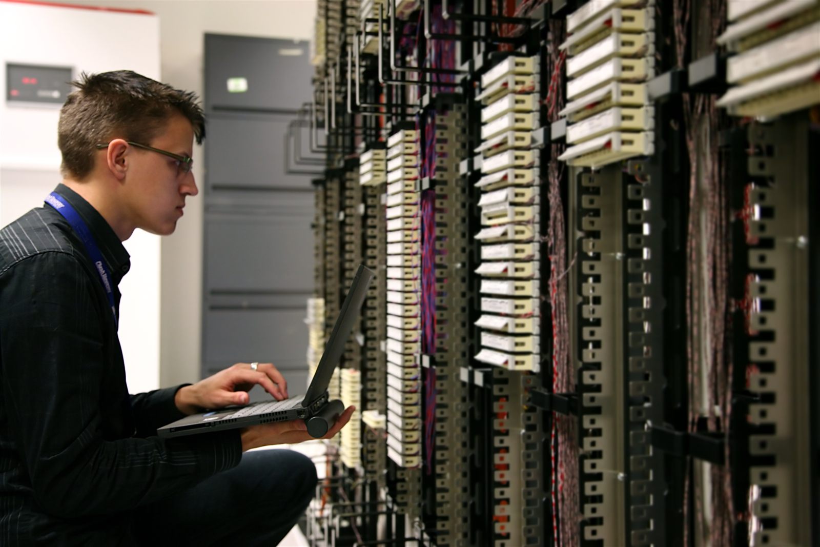 Technician working with data center cabling