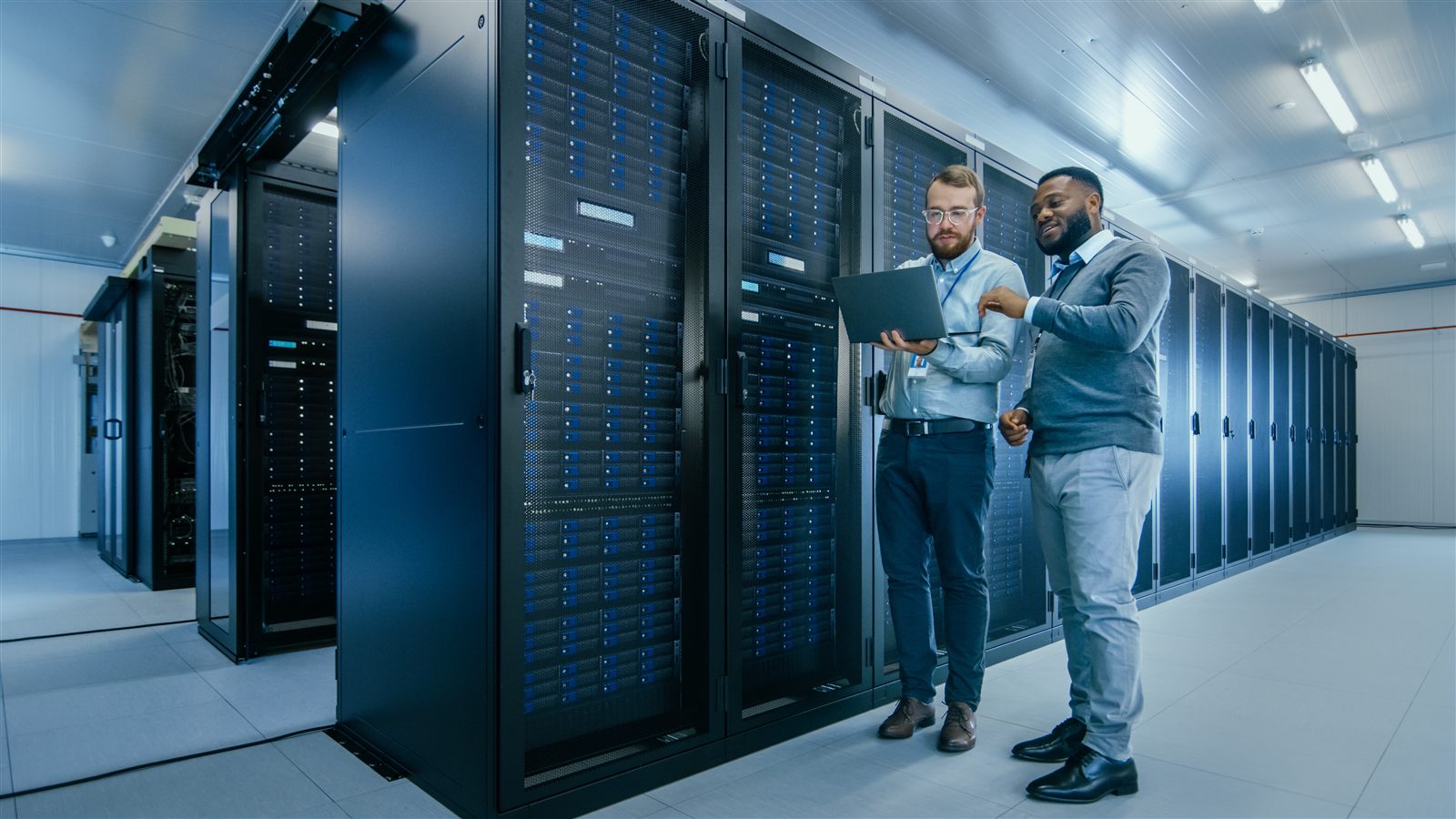 IT engineers reviewing systems in a data center